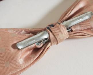 Closeup of the variety of clip-on bowties - This one has "Crown" and "Chicago" on the clip