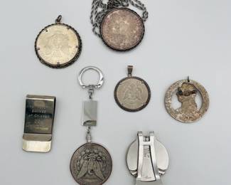 Reverse view of antique coins as medallions, key fobs, money clips