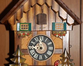 Closeup of vintage Black Forest Chalet cuckoo clock