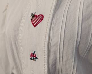 Closeup of embroidered white blouse