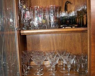 Closeup of vintage glassware - wine glasses, cocktail glasses, champagne flutes, and more