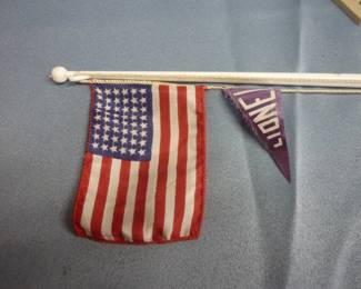Closeup of Lionel Trains Flagpole No. 89, post-war 1956-58, original box in excellent condition, 48-star American flag and purple Lionel pennant both in VG condition