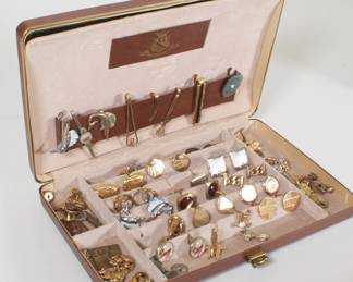 Jewelry case containing multiple vintage cufflink sets, tie bars and tie tacks
