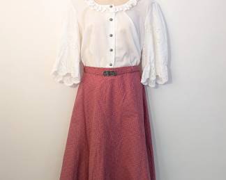 Women's white blouse with lace sleeves and belted skirt