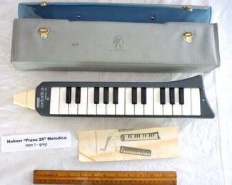 Hohner “Piano 26" Melodica made in Germany, grey case, grey body. 1 in fair/good condition w/ instructions, repaired corner, and 1 in very good condition w/ instructions