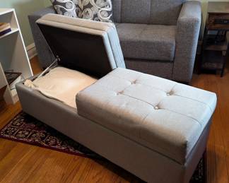 Large padded bench with storage compartments