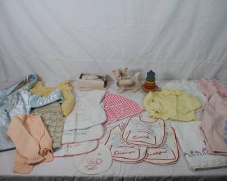 Children and baby clothes including knitted sweaters, hand-made dresses, coats, embroidered bibs
