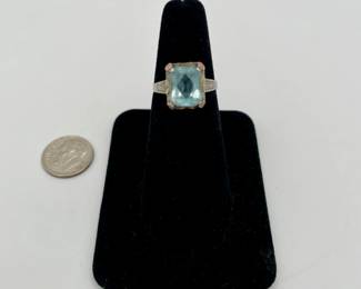 10kt white gold ring with cushion cut aquamarine color stone