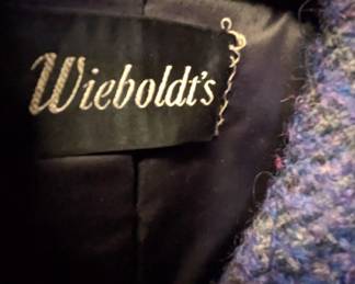 Closeup of women's blue double-breasted coat, boucle material, Wieboldt's label