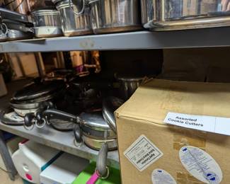 Many pieces of Revere Ware - lidded saucepans, frying pans, and more - and a box of assorted cookie cutters!