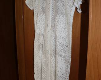Vintage 1960s women's white short sleeve mid length shift dress with airy crocheted floral designs