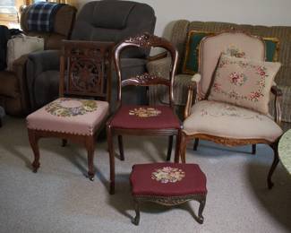 Vintage wooden chairs with embroidered upholstery, some with matching footstool or cushions