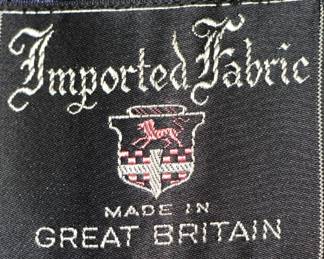 Label inside dark blue 3/4 length winter coat, made in Great Britain