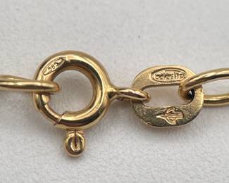 Closeup of 14kt gold woven chain necklace clasp