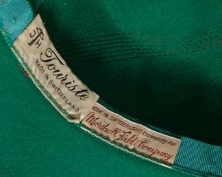 Label inside women's vintage green hat showing Made in Switzerland Expressly for Marshall Field & Company