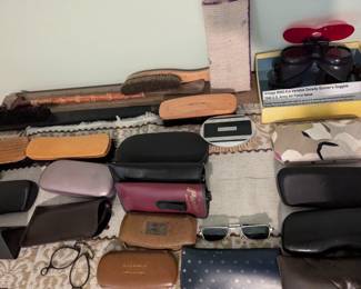 Men's shoeshine items, clothes brushes, sunglasses and cases, shoe horns