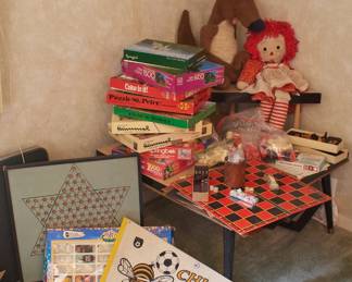 Raggedy Anne doll, jigsaw puzzles, Chinese checkers board, chess and checker boards and pieces, vintage Chicago Sting pennants