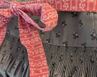 Another closeup of women's German dirndl dress, long sleeved, with apron