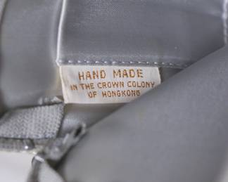 Inside of one handbag with label reading Hand Made in the Crown Colony of Hong Kong