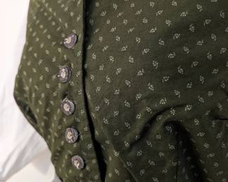 Closeup of women's German dirndl dress, 3/4 length sleeves, apron