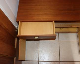 Another view of hall / entryway unit with mirror, coat rack, shelf, cabinets