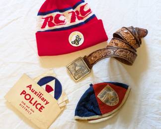 Tooled leather belt with Notre Dame belt buckle, Chicago Sting knitted pompom hat, German beanie, Auxiliary Police 35th and 36th District cloth badges