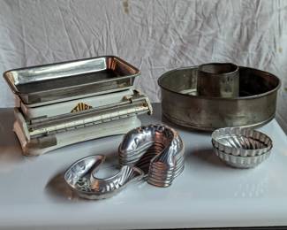 Vintage food scale, salmon-shaped metal molds, large metal baking pan and large antique spring form pan