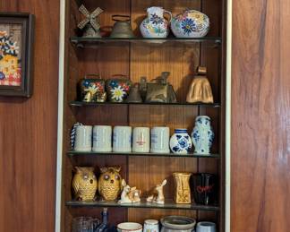 More of the beer stein collection – and metal cowbells from Switzerland, Germany; porcelain figurines, glassware