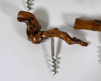 Closeup of vintage wood handle corkscrew wine bottle openers, possibly German