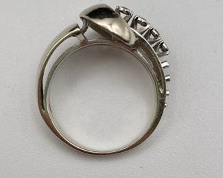 Closeup of 14kt white gold and diamonds ring in art moderne design