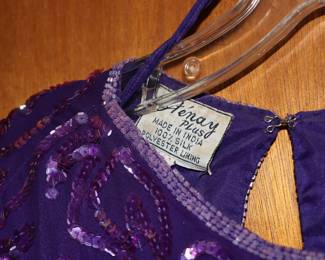 Closeup of women's purple silk and sequin short-sleeve top and matching skirt, Sténay Plus label, made in India