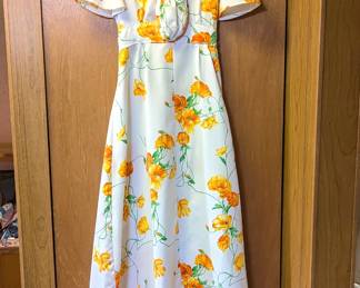 Women's cap-sleeve white dress with orange floral print, includes matching small bag
