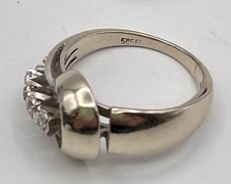 Closeup of 14kt white gold and diamonds ring in art moderne design