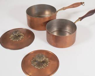 Another view of vintage copper saucepans with lids, wooden handles, made in Italy