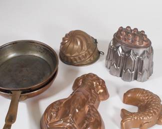 Another view of vintage to antique figural copper molds and saucepans, some made in Germany