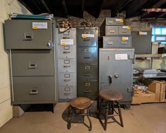 Victor "Fire Master" Super LX fire-resistant 3-drawer filing cabinet, Remington-Rand "Aristocrat" 5-drawer filing cabinet, Mosler Safe Class A Cat. No. 1630-A Serial No. 163636, and 2-drawer metal filing cabinets of different sizes