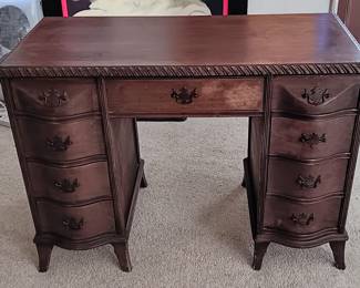 Federal style, wooden writing desk. Some water damage, as can be seen in the photos, with minimal "wear and tear." The 7 drawers are 20 inches deep. With a very minimal amount of TLC, this desk can be restored to it's former glory! As is, it is in all original condition. 