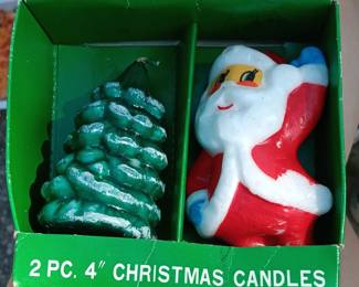 Assortment of vintage Christmas candles, decorations, and ornaments