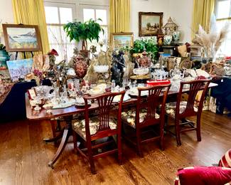 LARGE DINING AREA WITH DECOR ALL AROUND THE PERIMETER.