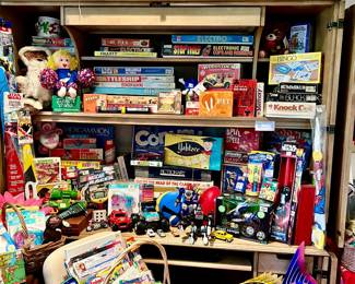 COMPUTER CABINET LOADED WITH VINTAGE TOYS AND GAMES.