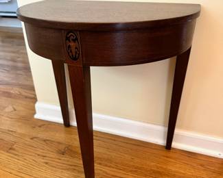Vintage Kittinger mahogany half round table.  This piece measures 20”W x 21”T