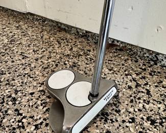 Selection of golf clubs, including a brand new Callaway Razr X, a rare Odyssey White Hot putter, Ping TFC 129 Regular G10 putter, and a rare putter made for 3M