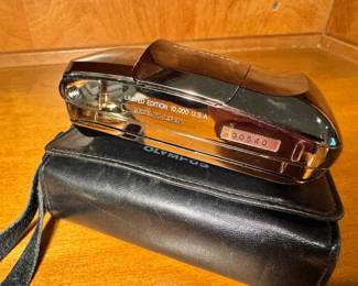 Olympus Infinity Stylus 35mm camera in Limited Edition Chrome with original leather case.  This is number 540 of 10,000