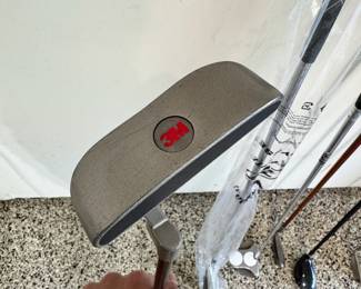 Selection of golf clubs, including a brand new Callaway Razr X, a rare Odyssey White Hot putter, Ping TFC 129 Regular G10 putter, and a rare putter made for 3M