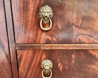 Antique sideboard with lion head pulls