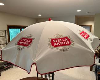 Vintage Stella Artois patio umbrella.  This item appears to have never been used!