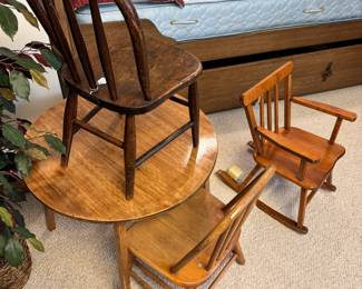 Vintage children’s wood furniture, including a musical rocking chair and one chair with Board of Education metal tag