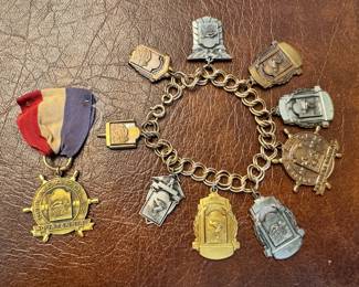 1950’s Minneapolis Aquatenial women’s 100yd Freestyle 1st Place medal and 1950’s girls swimming medal charm bracelet