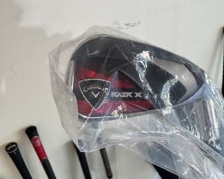 Selection of golf clubs, including a brand new Callaway Razr X, a rare Odyssey White Hot putter, Ping TFC 129 Regular G10 putter, and a rare putter made for 3M