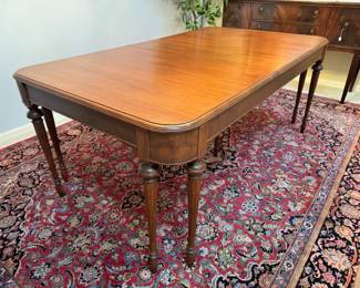 Beautiful antique mahogany wood dining set.  The table measures 42” wide x 62” deep, and extends to 98” with the three 12” leaves.  This table comes with a full set of table pads
